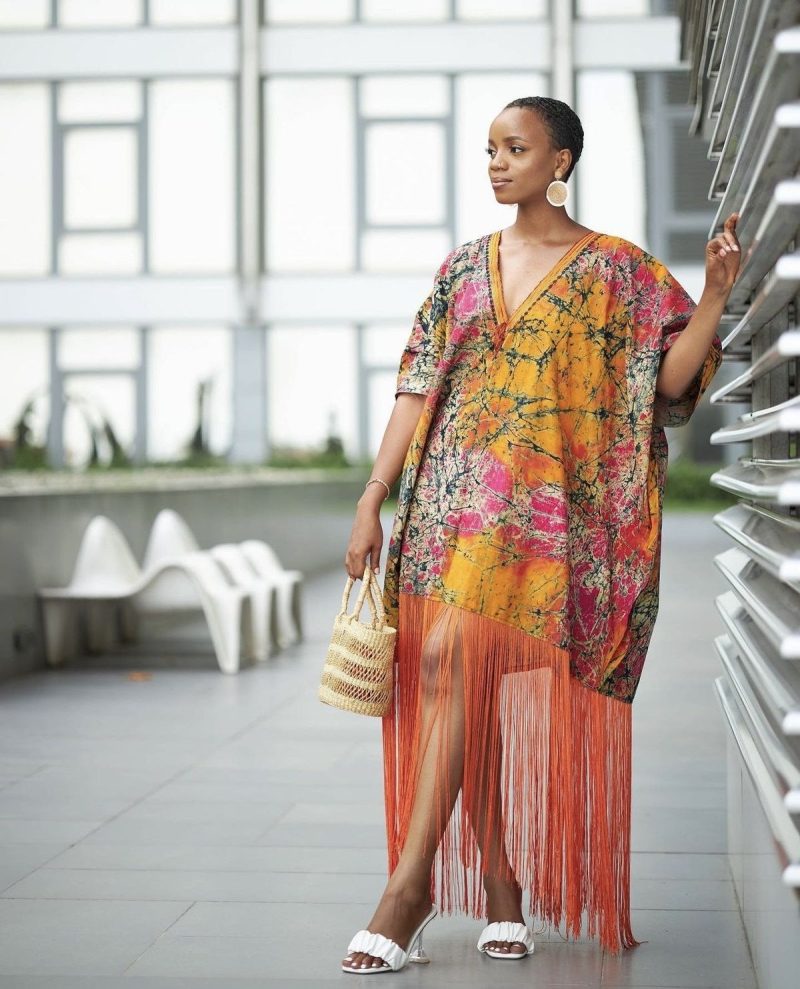 Naturally-dyed indigo textile styled minimally with understated jewellery, illustrating sophisticated, cultural elegance.