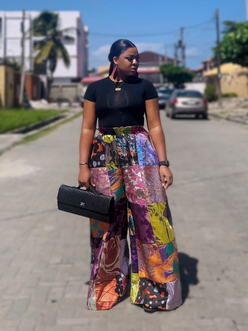 Adire trousers styled with a tee in an Afro-street look.