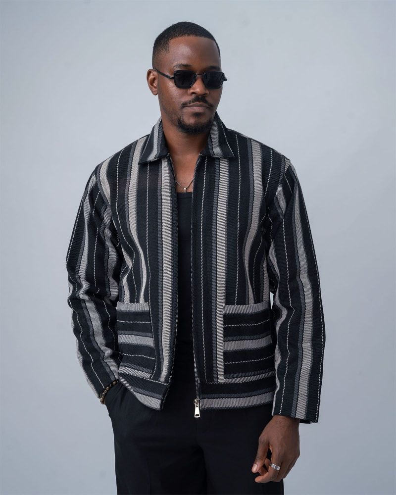 Man wearing a modern minimal Aso-Oke jacket