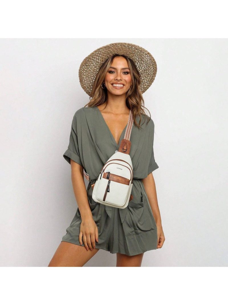 A woman wearing a minimalist crossbody bag across the chest.