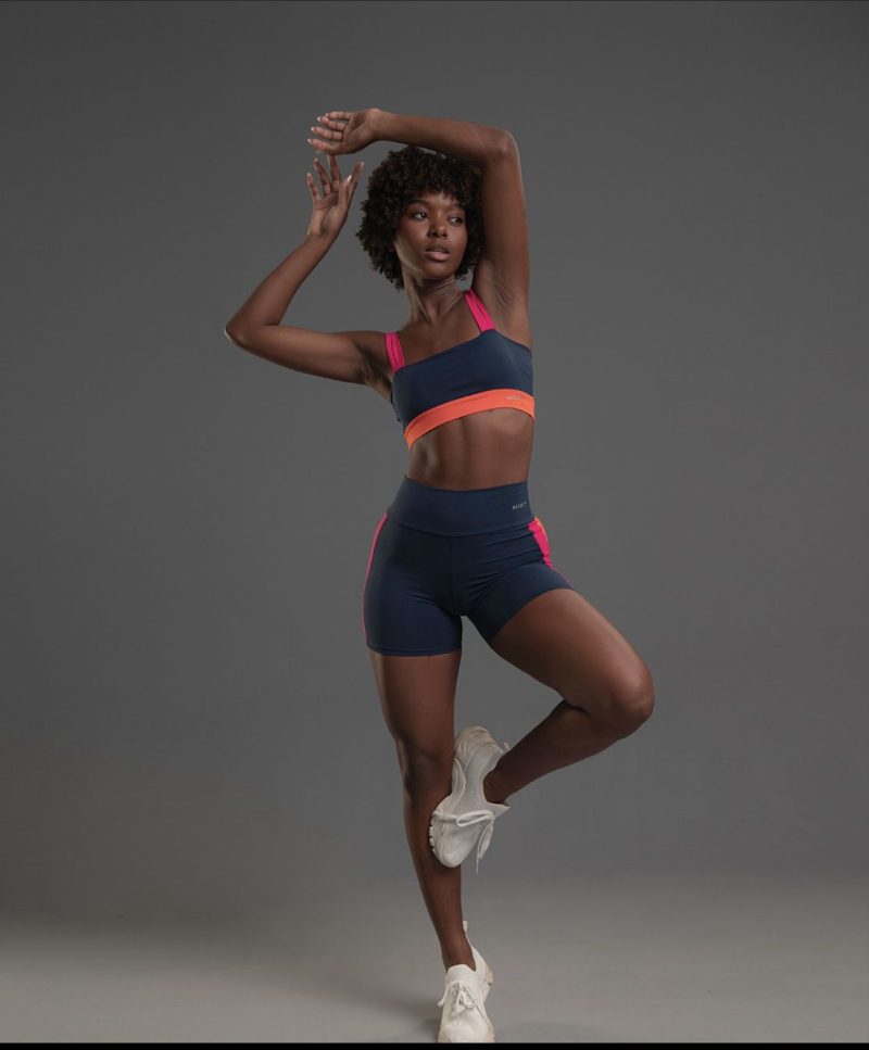 An African woman in eco-friendly organic cotton sportswear.