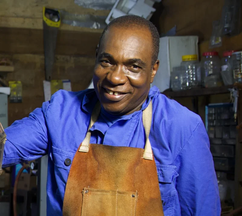 Olu Amoda in his workshop with tools and equipment