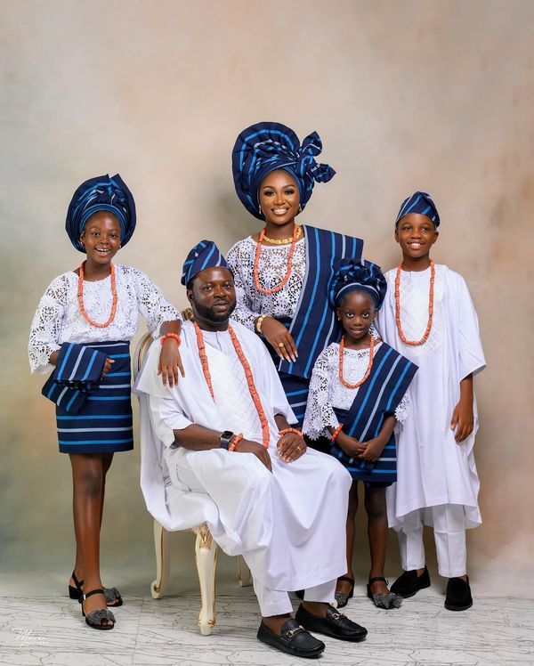 A modern African family wearing quite luxurious outfits