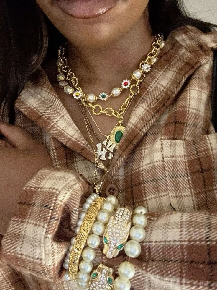 Layered beads and gold chains for Afro-street fashion