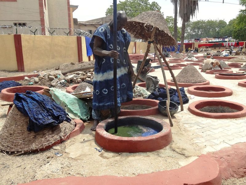 Kano, Nigeria, has traditional clay indigo dye pits that illustrate the ancient method of textile dyeing in West Africa.