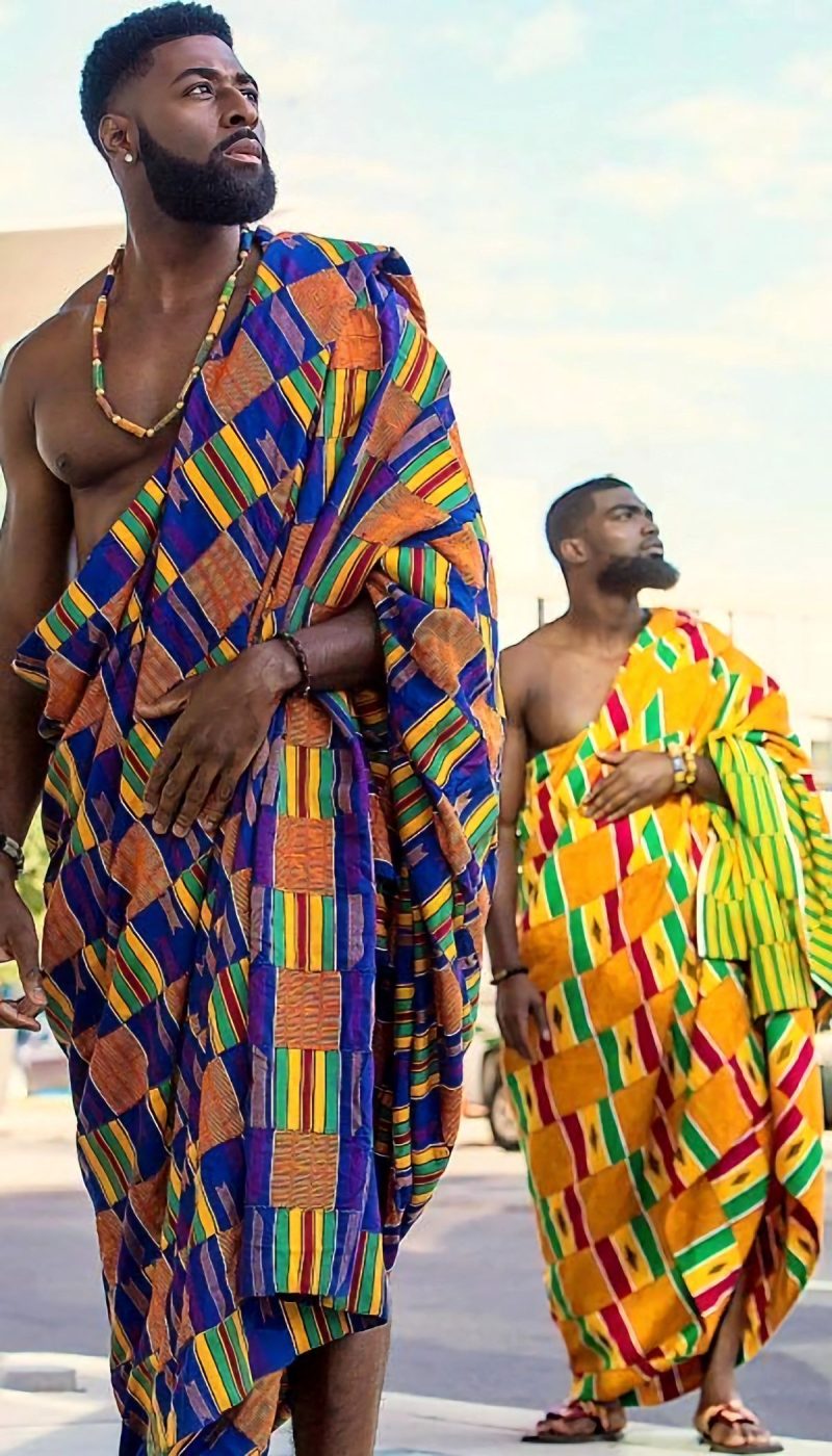 African men wear hand-woven Kente clothing.