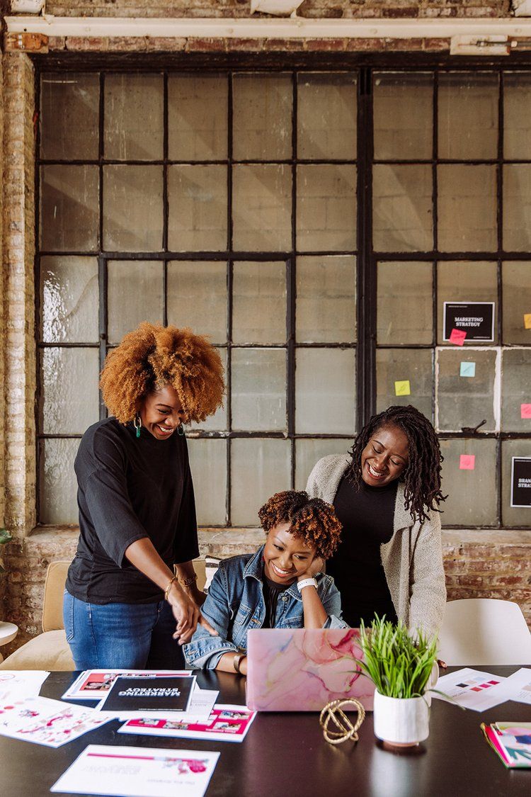 A diverse team of modern African designers in a clean studio reviewing ESG data on a tablet, representing Afropolitan Investment Leadership and Methodological Authority.
