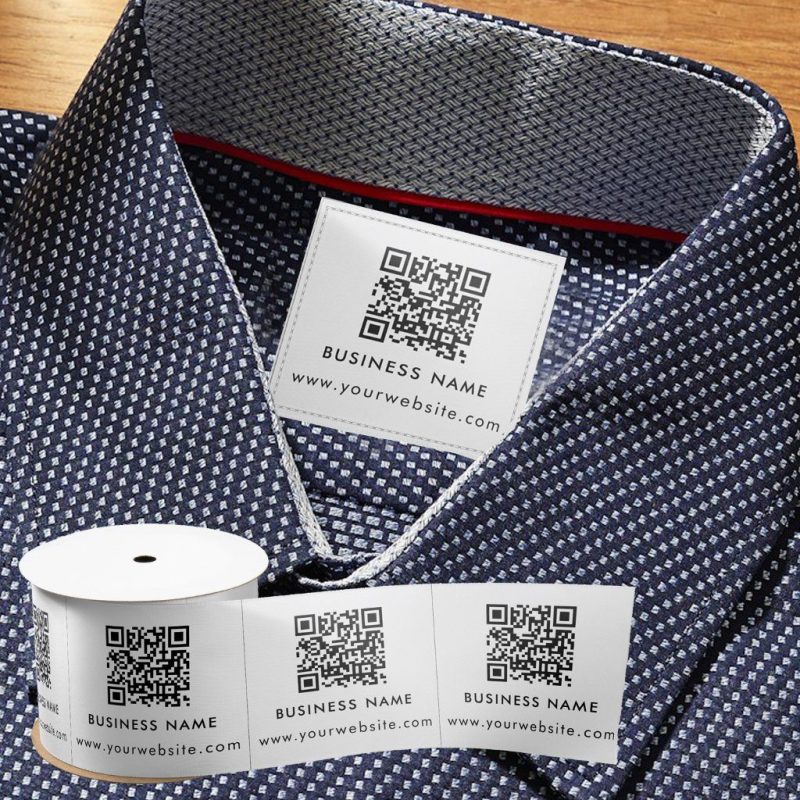 Luxury garment label with an embedded QR code, symbolising the use of blockchain technology for tracking product provenance and ensuring authenticity.