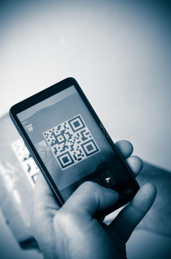 The image shows a close-up of a smartphone scanning a QR code on a product, symbolising the use of blockchain technology for provenance and authentication in artisanal luxury goods, which drives investor confidence and value.