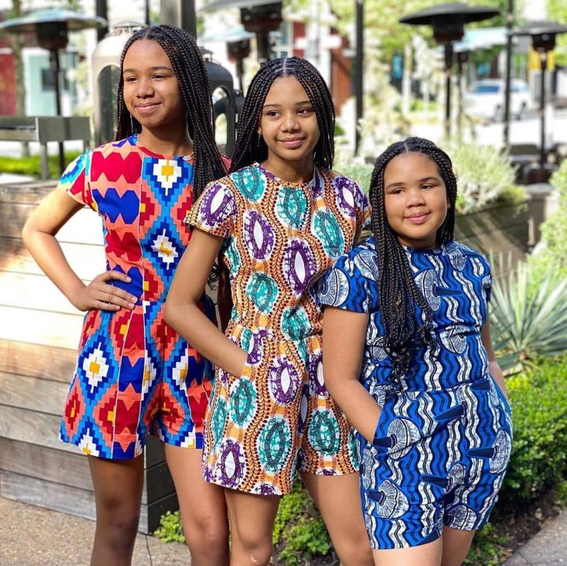 Children of different ages wearing matching heritage-driven garments symbolise the durability and intentional design that make the clothing a family heirloom.