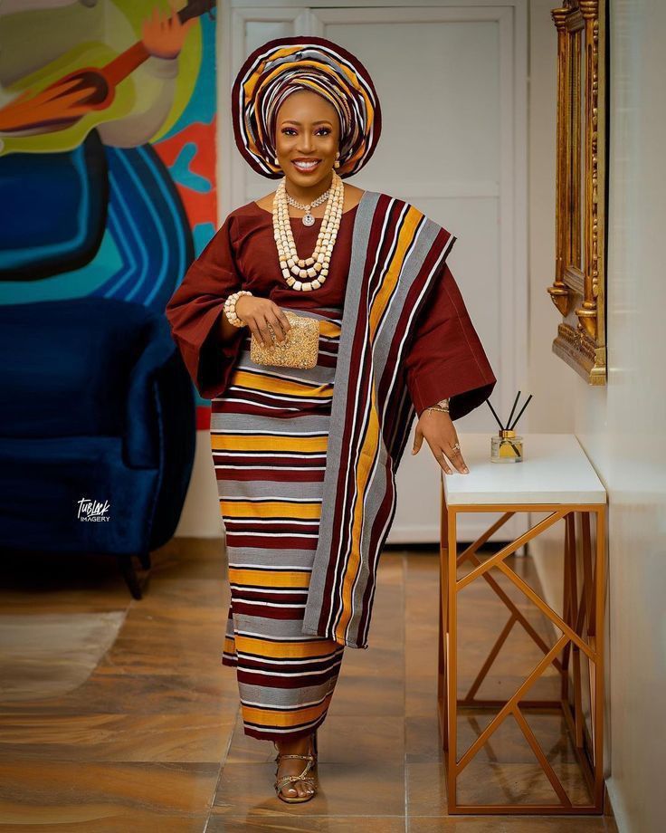 A Yoruba woman in an Aso Oke attire.