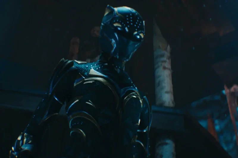 Black Panther character in metallic suit from Black Panther: Wakanda Forever movie scene