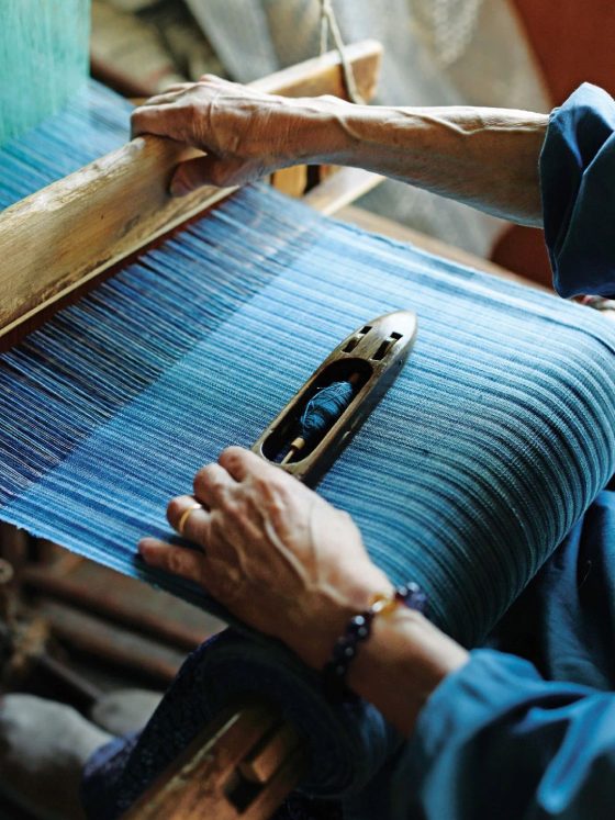 A diverse team of modern African designers in a clean studio reviewing ESG data on a tablet, representing Afropolitan Investment Leadership and Methodological Authority.