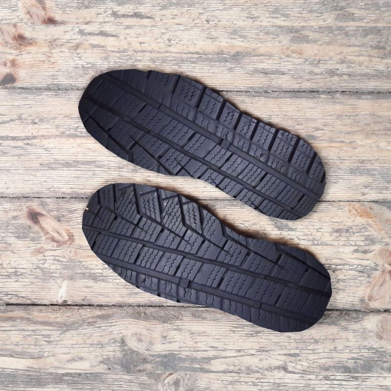 Close-up of a shoe sole made from repurposed tyre rubber, demonstrating material innovation and commitment to environmental sustainability