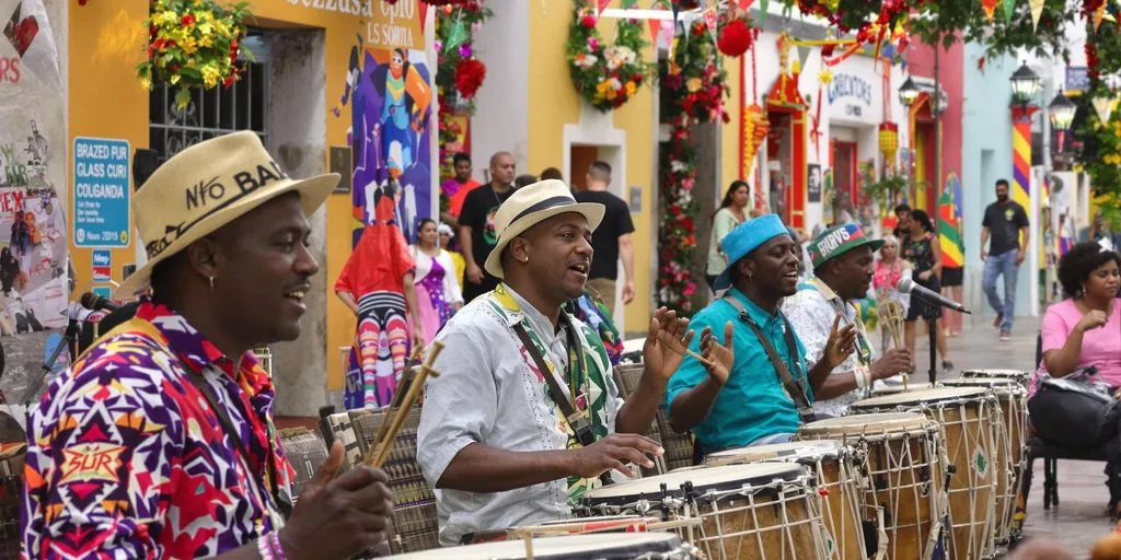 Salvador street musicians celebrate Afro-Brazilian cultural renaissance through traditional percussion.
