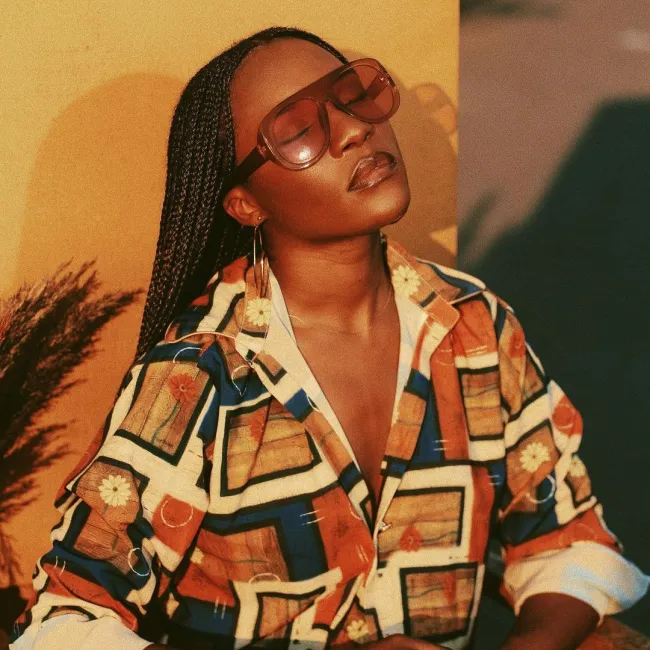 From Image to Infrastructure
Despite lacking structural support, Congolese fashion has maintained its visibility over time. Garments, prints, and silhouettes appeared on international stages detached from the local ecosystems that produced them. What distinguishes the current generation of designers is a refusal to separate aesthetics from infrastructure.
Fashion power is not determined solely by visibility. It is determined by who controls production, who sets standards, and who decides how stories are told. In Kinshasa, women designers are increasingly addressing all three.
They are establishing ateliers, formalising artisan relationships, educating younger makers, and defining what contemporary Congolese fashion looks like without translating. This is fashion understood as industry, not ornament.
Laëtitia Kandolo and the Authority of Structure
Pc: Media Sema
Laëtitia Kandolo’s work operates with clarity rather than noise. As the founder of Uchawi, she approaches fashion as an exercise in structure, asking how garments communicate authority, presence, and modern identity without theatrical excess.
Her designs favour disciplined tailoring, strong lines, and deliberate proportion. Cultural references exist, but they are embedded rather than displayed. Nothing feels explanatory. The clothes assume the wearer understands them.
Kandolo’s influence extends beyond design. Her engagement with cultural institutions and policy spaces reflects an understanding that fashion does not sit outside civic life. By participating in conversations about culture, representation, and industry standards, she expands the designer's role from creator to architect.
In Kinshasa, this matters. It signals a move away from fashion as individual expression toward fashion as a collective structure.
Natacha Ngoy and the Logic of Continuity
Where Kandolo’s work is architectural, Natacha Ngoy’s practice is connective. Her focus lies in textiles, process, and continuity. She works closely with artisans whose skills are inherited rather than taught in classrooms, integrating their knowledge into contemporary garments designed for daily life.
Ngoy’s pieces are refined but grounded. Fabric choices prioritise durability and feel. Construction is careful, not decorative. The result is clothing that feels lived in from the moment it is worn.
What distinguishes her approach is restraint. She does not elevate tradition by isolating it. She preserves it by using it, allowing textiles and techniques to evolve through wear rather than exhibition. In doing so, she ensures that craft remains economically and culturally viable.
Women as System Builders
Much of the conversation around women in fashion focuses on visibility. In Kinshasa, the more meaningful shift is structural. Women designers are building supply chains, creating jobs, and formalising processes that allow fashion to function sustainably within the local economy.
This work rarely attracts attention because it is unremarkable. It happens in workshops, training sessions, and long-term partnerships. Its success is measured in consistency rather than virality.
Empowerment, in this context, is not a slogan. It is a framework.
Reframing Global Engagement
Pc: Patty Braz
As global fashion increasingly turns toward ideas of craft, sustainability, and authenticity, Kinshasa’s designers are not adapting to these conversations. They have been operating within them for decades. What has changed is recognition.
Rather than presenting Congolese fashion as exotic or archival, these designers insist on contemporaneity. Their work belongs to the present. It speaks the language of global fashion without asking permission.
This reframing is subtle but significant. It positions Congolese fashion not as alternative, but as authoritative.
A Different Measure of Success
Success in Kinshasa is not defined by runway invitations alone. It is characterised by longevity, consistent production, and the strength of the ecosystem supporting the work.
Designers are judged not only by aesthetics but also by how well they sustain relationships with makers, how responsibly they source materials, and how clearly they articulate their vision. Fashion becomes less about image and more about coherence.
This shift reflects a broader rethinking of value within the global industry.
Read also:
Abidjan Ascendant: Inside Ivory Coast’s Quiet Fashion Renaissance
BUZIGAHILL: The Ugandan Label Shaping Global Upcycling
How African Sourcing is Rewriting Global Luxury Standard
What Kinshasa Offers Fashion Now
Pc: Bria
The lessons emerging from Kinshasa are not about colour or print. It is about authorship. It is about transitioning from mere references to genuine recognition, about understanding fashion as a system that must be owned to be meaningful.
By prioritising structure over spectacle and continuity over novelty, Congolese women's designers are offering models that feel increasingly relevant in a fatigued global fashion landscape.
This is not due to its uniqueness but rather to its comprehensiveness.
Frequently Asked Questions
What is driving the rise of fashion in Kinshasa today?
Designer-led infrastructure, artisan collaboration, and ownership of narrative rather than surface aesthetics are driving the rise of fashion in Kinshasa today.
Who are the key women shaping Kinshasa’s fashion landscape?
Designers such as Laëtitia Kandolo and Natacha Ngoy are central, combining design, production systems, and cultural authorship.
How does Congolese fashion differ from global fashion trends?
It prioritises structure, continuity, and economic grounding over rapid trend cycles or spectacle.
Why is authorship important in contemporary African fashion?
Authorship determines who controls value, representation, and sustainability within the fashion ecosystem.
Is Kinshasa influencing global fashion conversations?
Yes. Its emphasis on craft, structure, and long-term thinking aligns with where global fashion is heading.