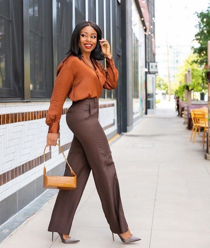 A picture showing a lady with fitted clothes.