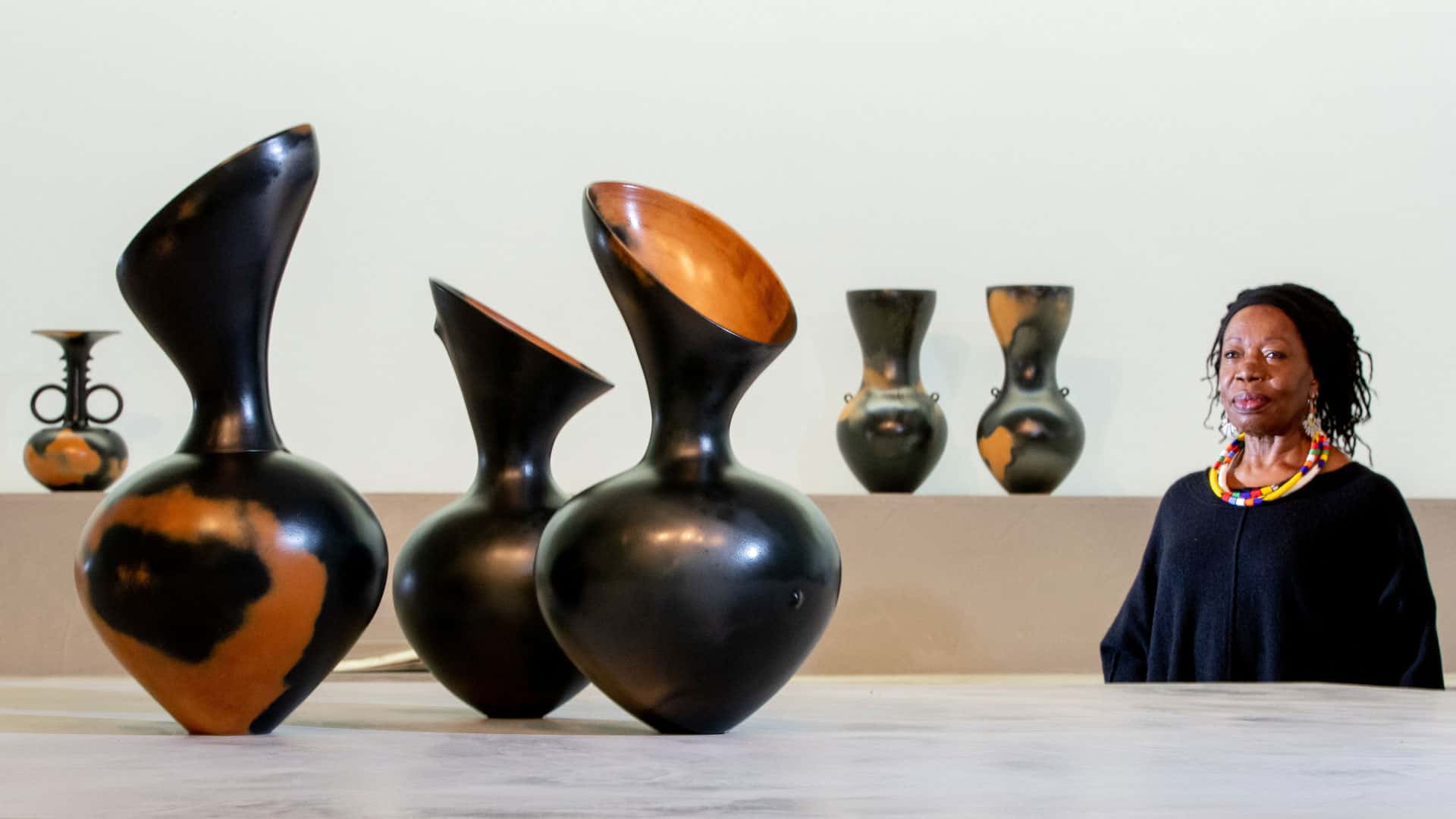Ceramicist crafting hand-built vessels that fuse African tradition with contemporary innovation.
