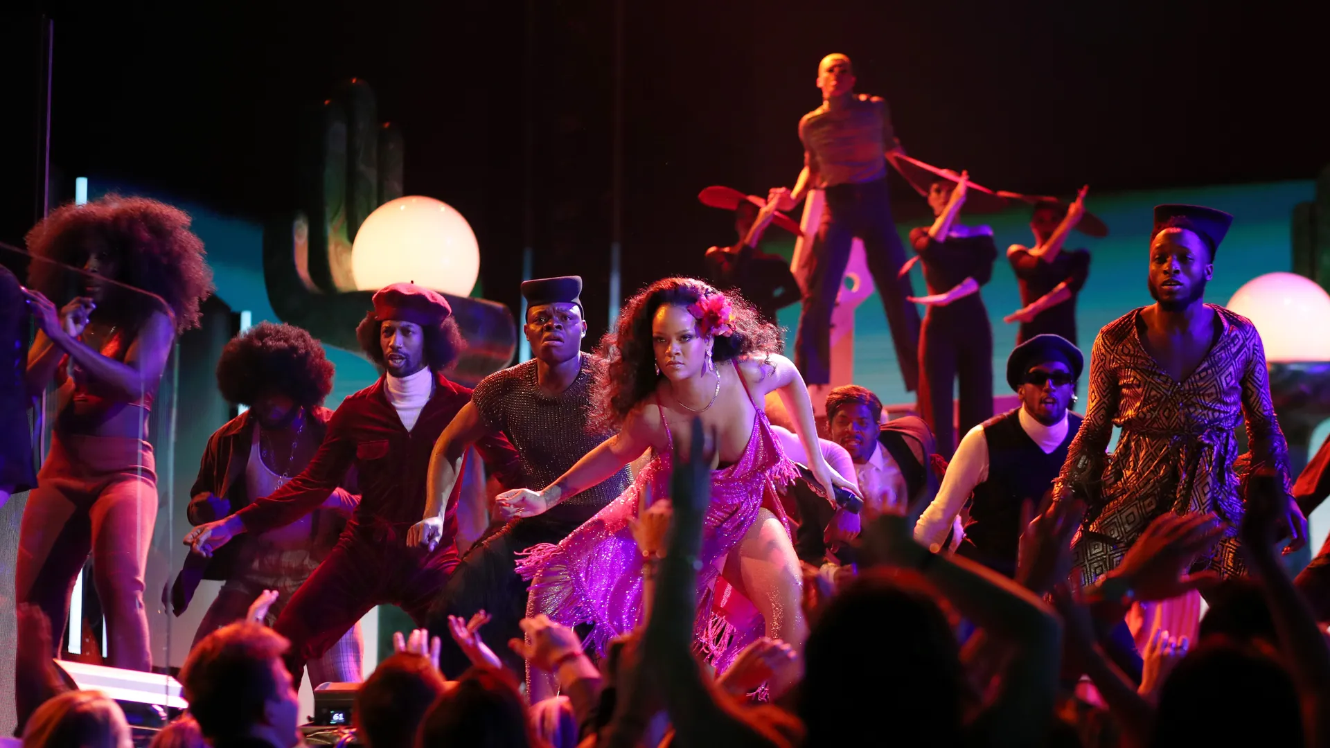Rihanna performs the Gwara Gwara dance on stage with backup dancers.
