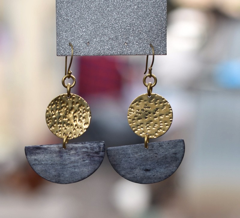 A picture of a cultural minimalist pair of earrings 
