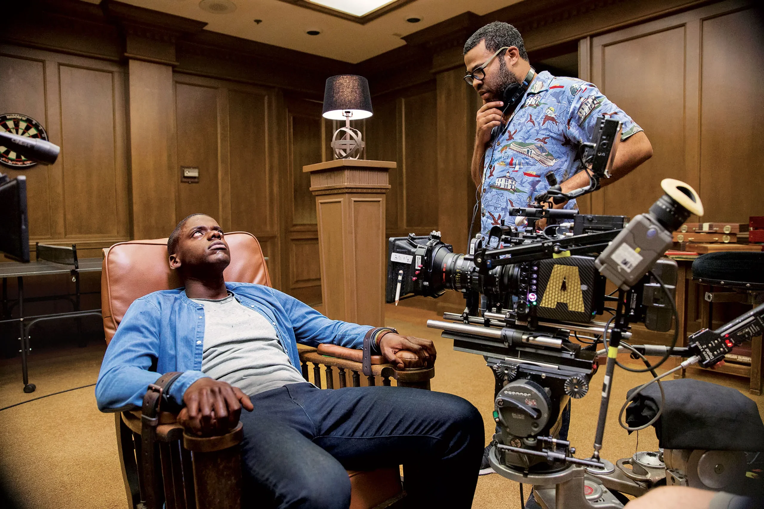 Jordan Peele directing Get Out, blending horror with racial commentary.
