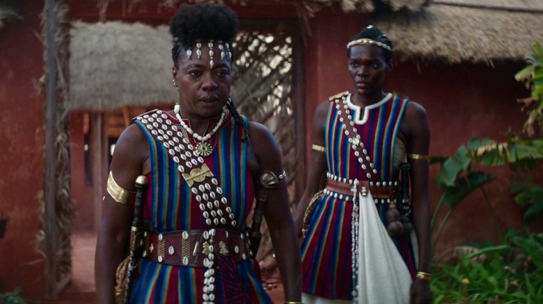 Dahomey warrior costumes featuring cowry shells and West African indigo-dyed fabrics