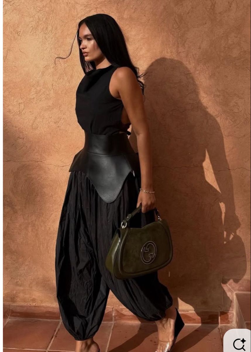 2026 luxury fashion featuring sculptural balloon trousers and minimalist styling. 
