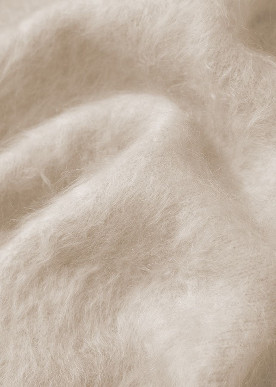 A close-up of sustainable brushed cashmere leading inclusive, sustainable fashion in 2026.
