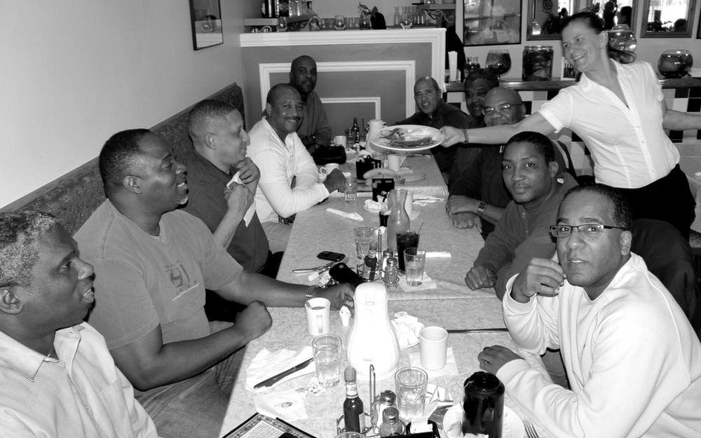 A picture showing how conversation at the dinner table brings ideas.
