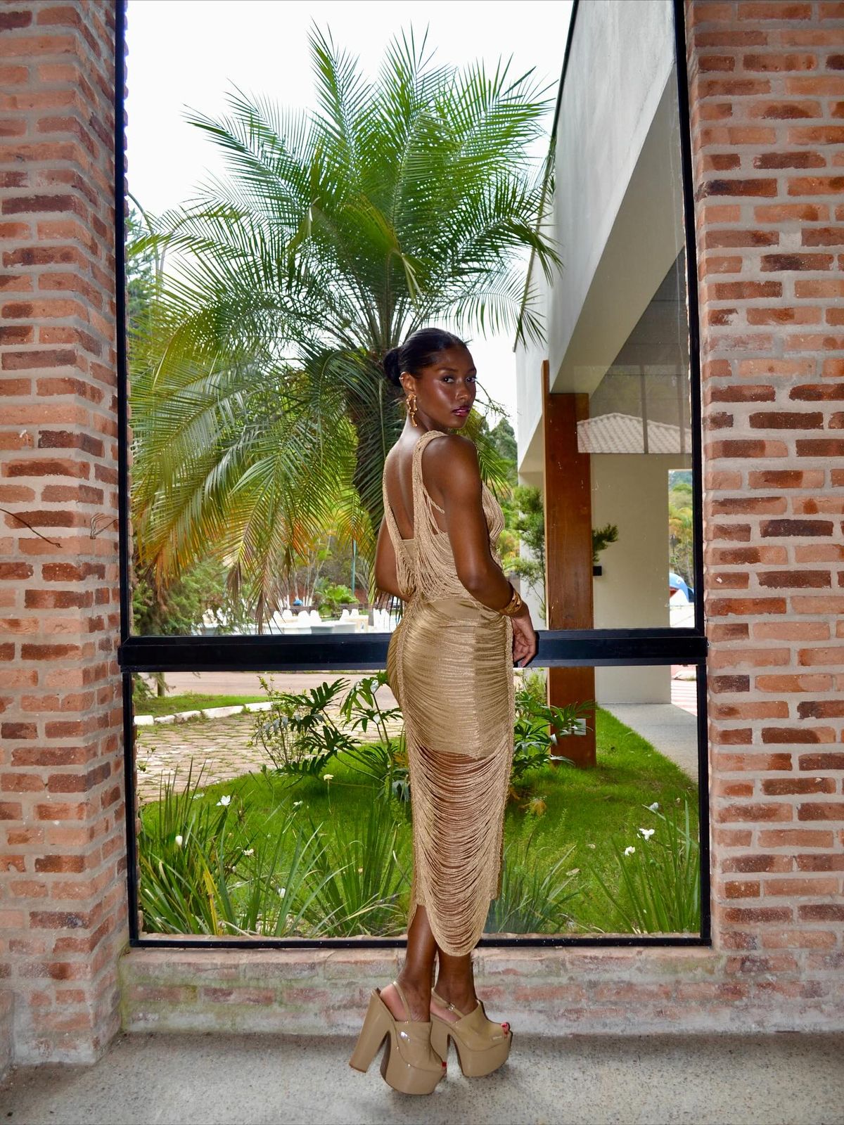 An inclusive woman in a high-end dress, representing the visionary fusion of visibility and belonging.