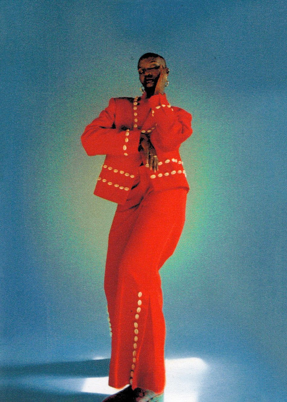 An inclusive woman in high-end Labrum London, representing the visionary fusion of British tailoring and West African storytelling.
