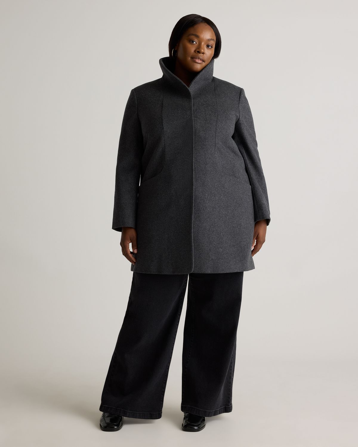 An inclusive woman in high-end tailoring, representing the beauty of subtle, sustainable heritage.