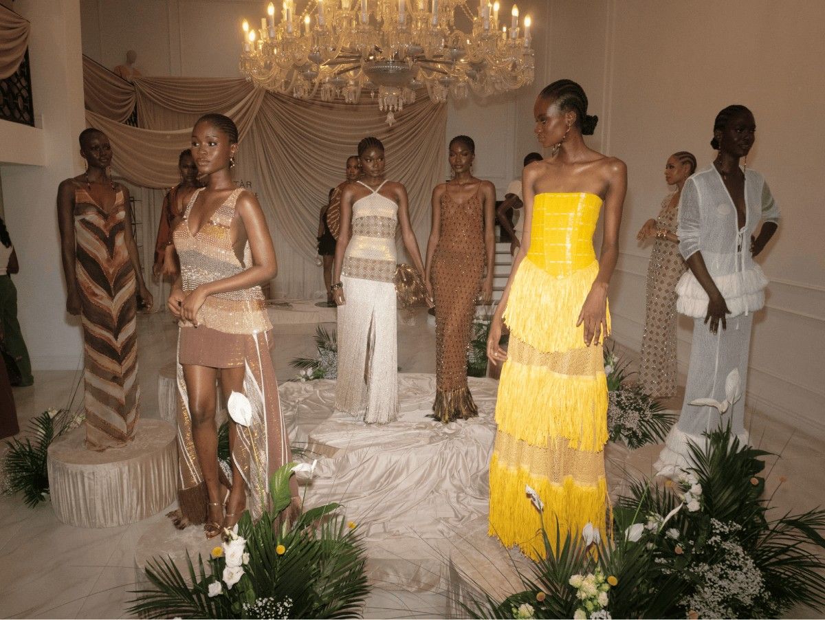 A picture of people dressed in different dresses showing how clothing has become a language of social organisation.