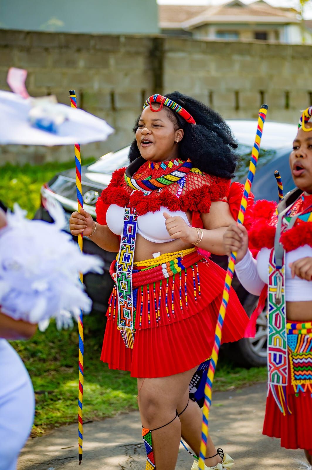 An inclusive woman in a high-end Zulu beaded collar, representing the beauty of patient South African craftsmanship.