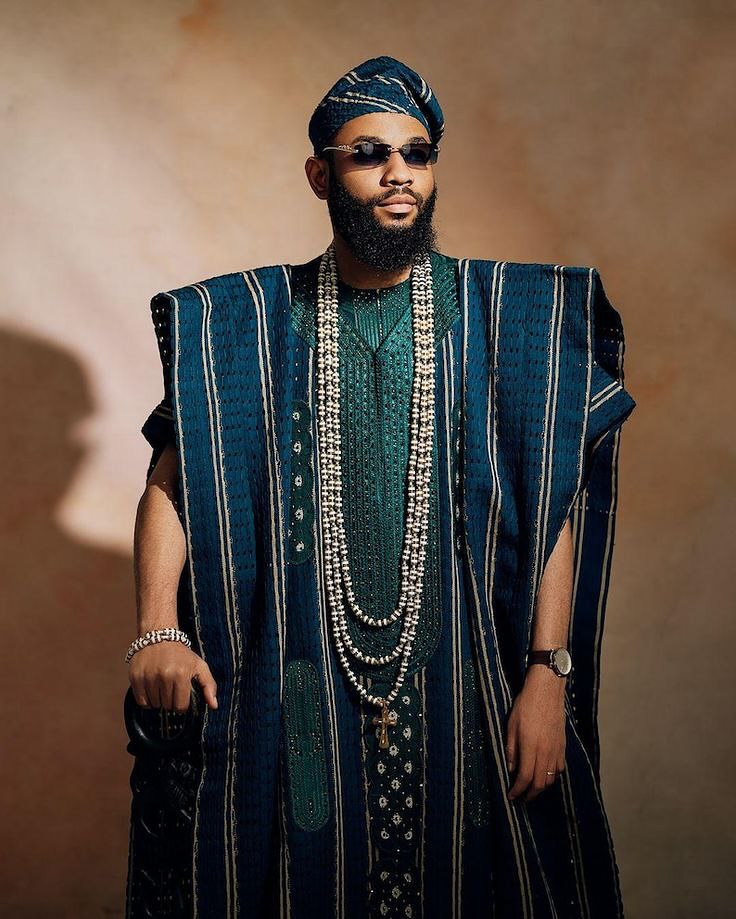 A picture of a man wearing an Agbada.