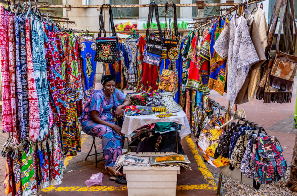 A picture showing a mini African stall filled with textiles.
