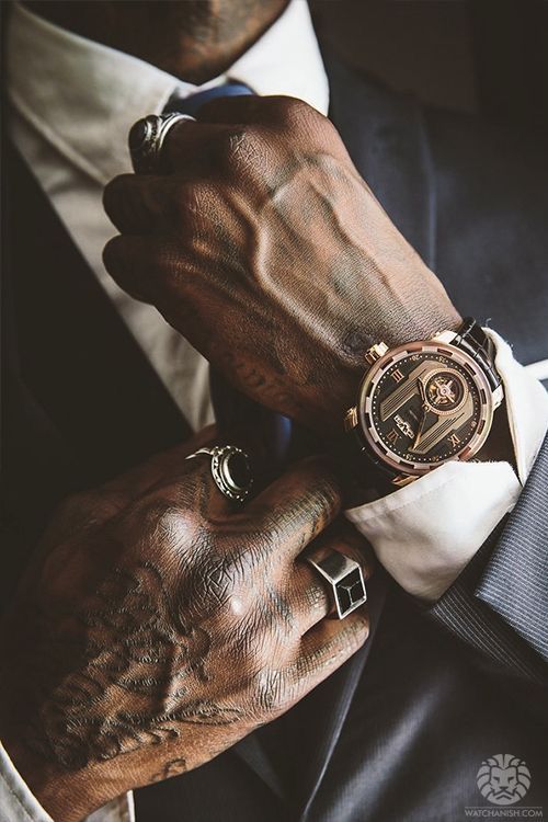 A close-up of a high-end mechanical watch on an inclusive man, representing the visionary fusion of craftsmanship and sustainable luxury.