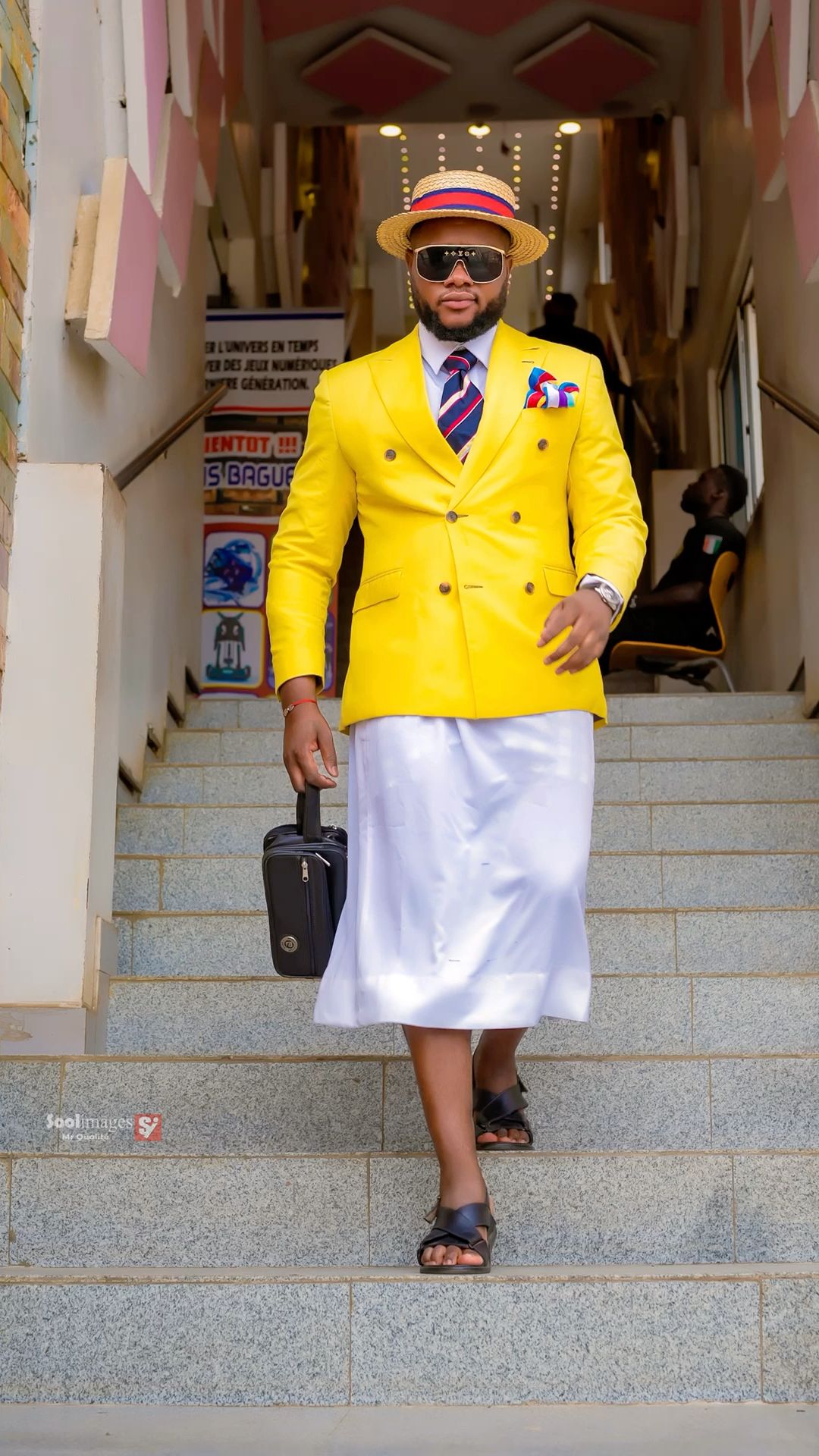 An inclusive man in a sustainable Kanzu and Kofia, representing the visionary fusion of coastal heritage and modern luxury.