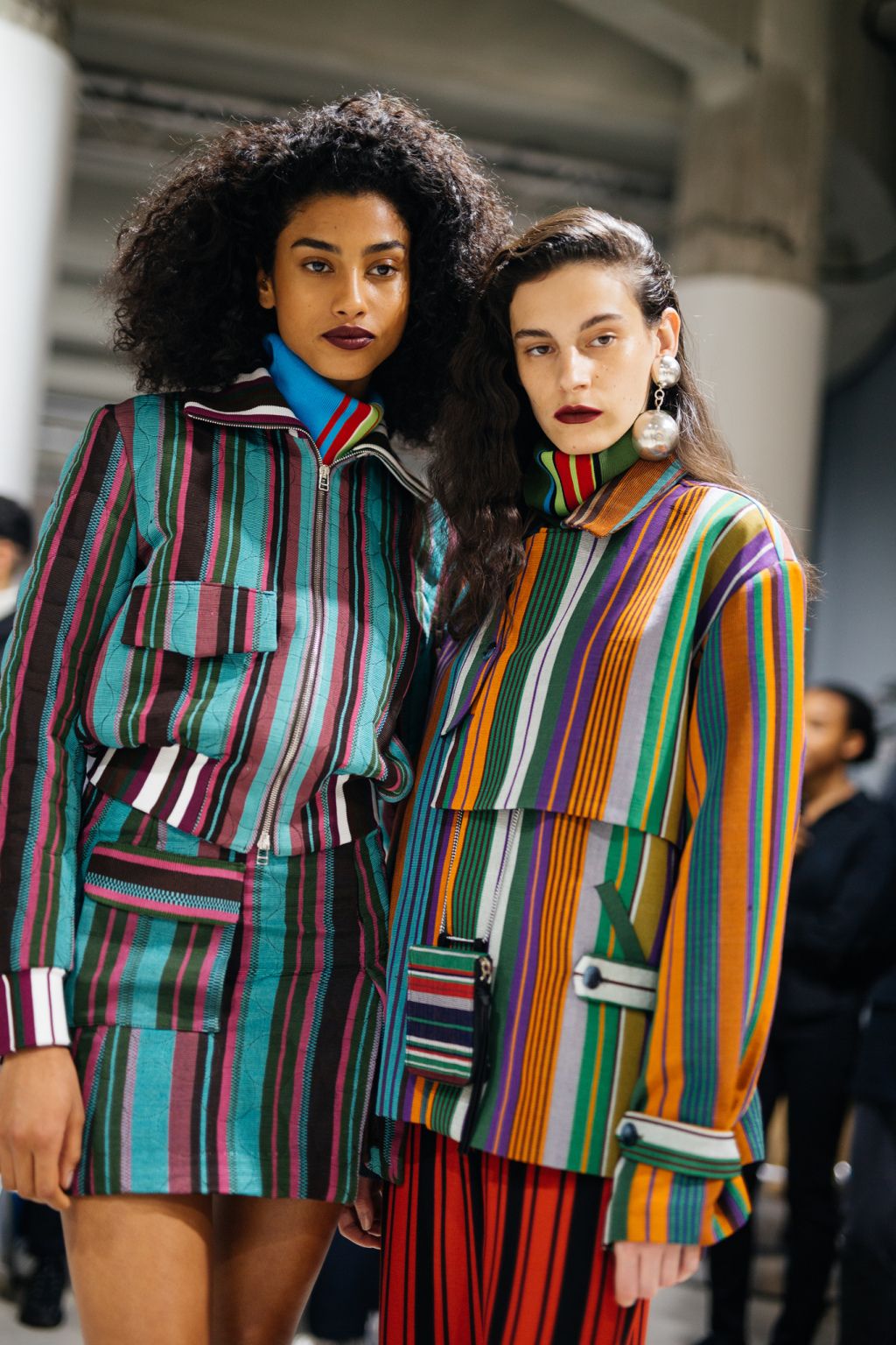 Inclusive women in high-end Aso-Oke tailoring by Kenneth Ize, representing the visionary fusion of heritage weaving and modern luxury.