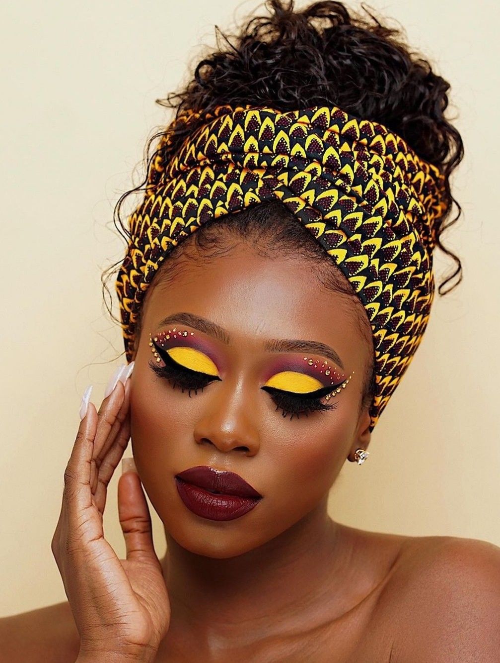 An image showing a lady wearing eyeshadow inspired by an African textile