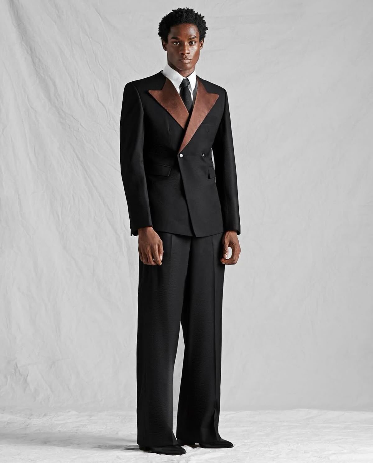 The Suit as Inheritance and Interruption