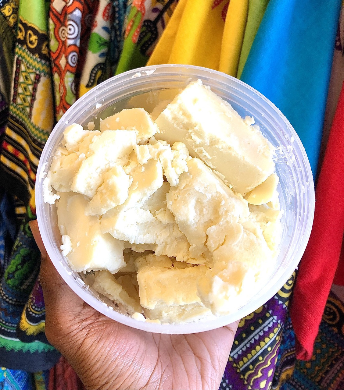 A picture showing a hand holding already processed shea butter
