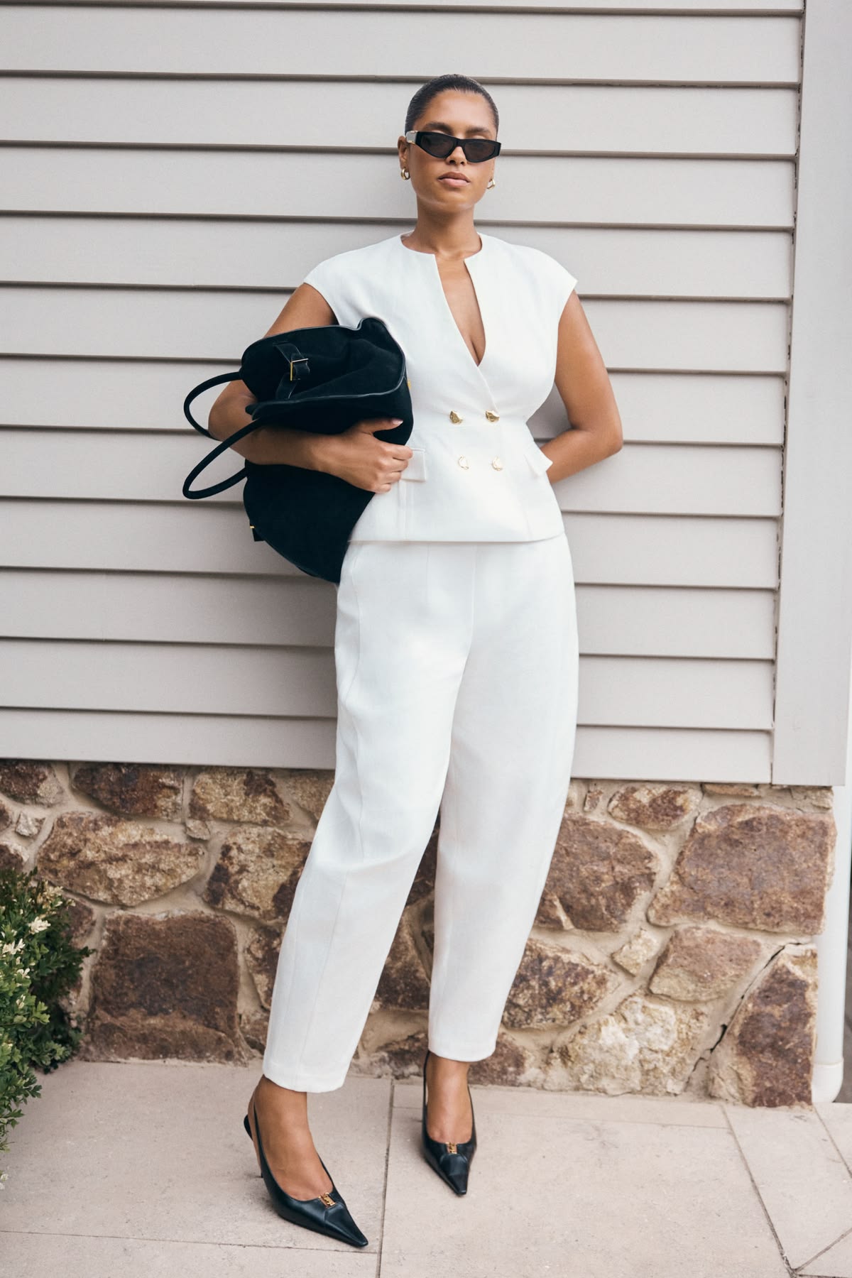 An inclusive woman in high-end sustainable tailoring, representing the visionary fusion of professional renewal and modern luxury.