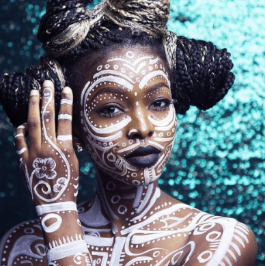  An image showing a lady with full body painting showing the impact of African body paint traditions in runway fashion
