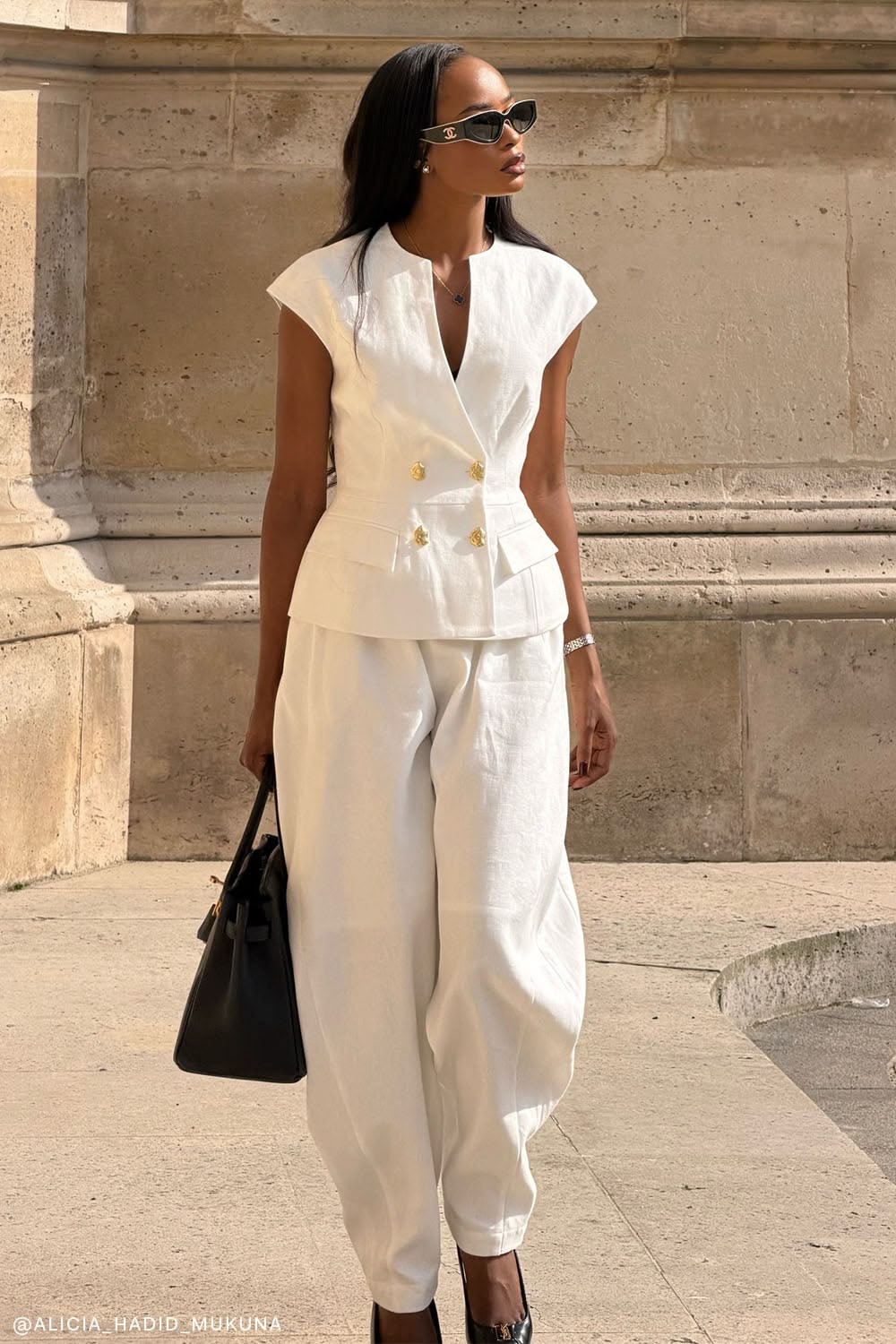 An inclusive woman in high-end sustainable tailoring, representing the visionary fusion of professional renewal and modern luxury.