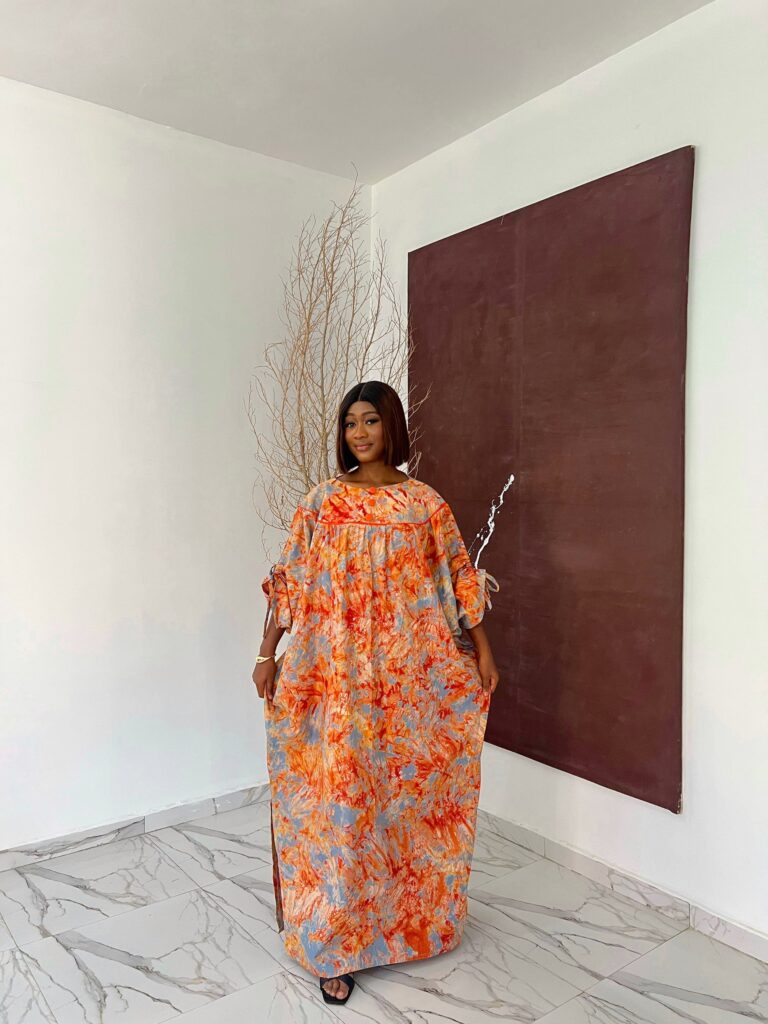 An image showing a lady wearing a bubu dress