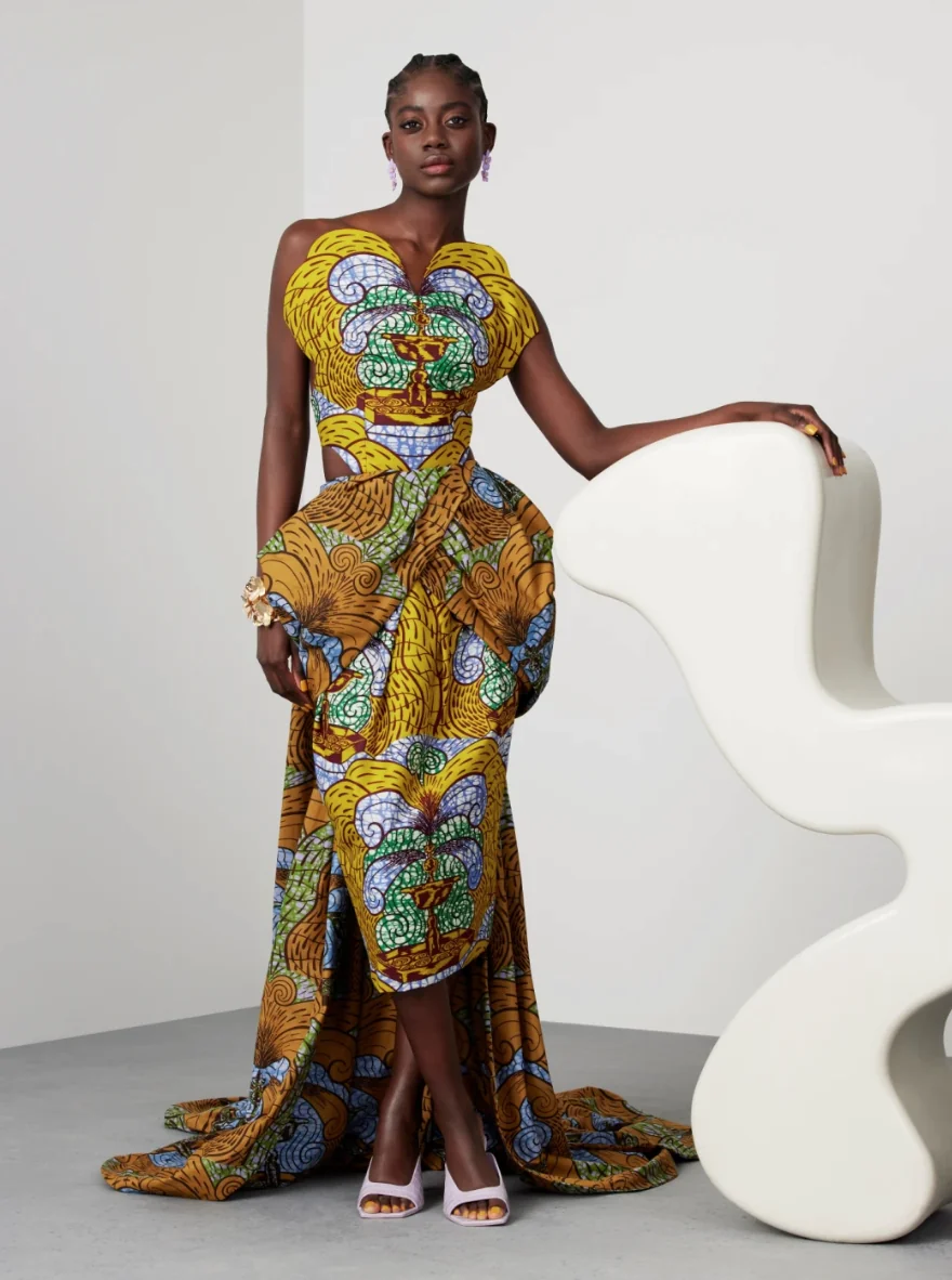 An image showing a lady dressed in wax prints, one of the fabrics for modern Ghanaian fashion
