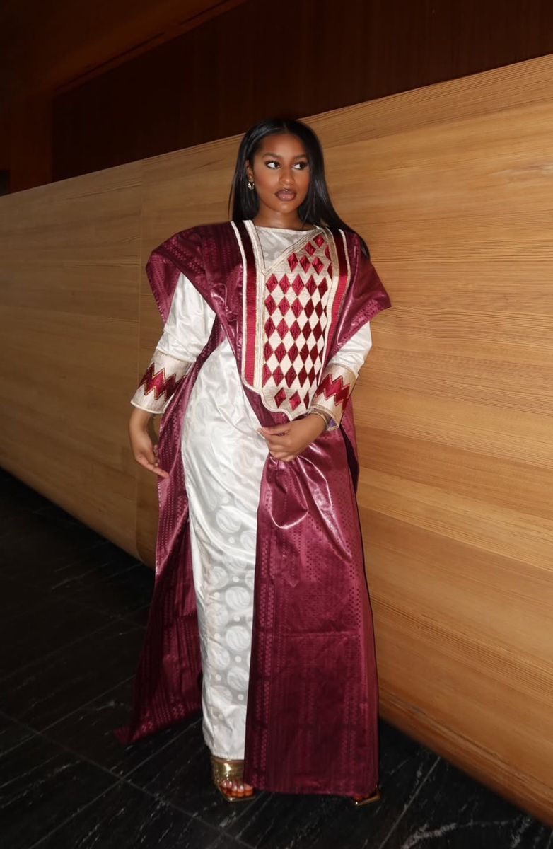 An image showing a lady dressed in a bazin dress
