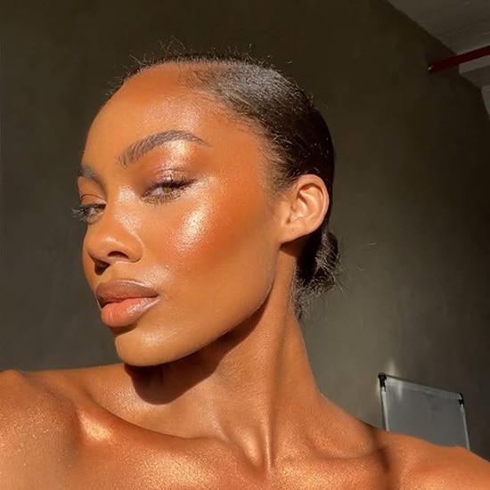  An image showing a lady wearing blush as part of her no-makeup makeup look for African skin