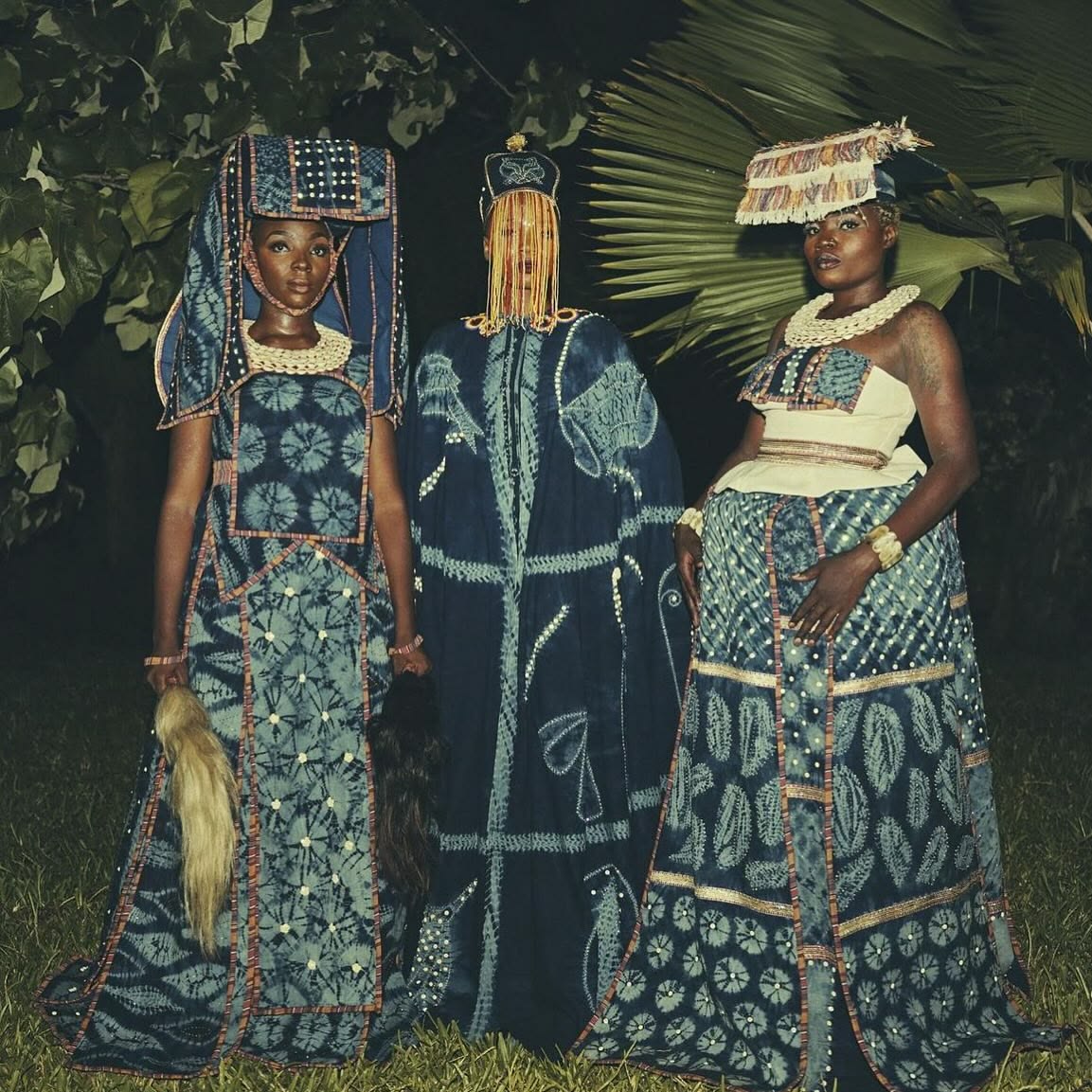 Traditional Nigerien clothing with indigo fabric and geometric embroidery, representing Sahelian design tradition.
